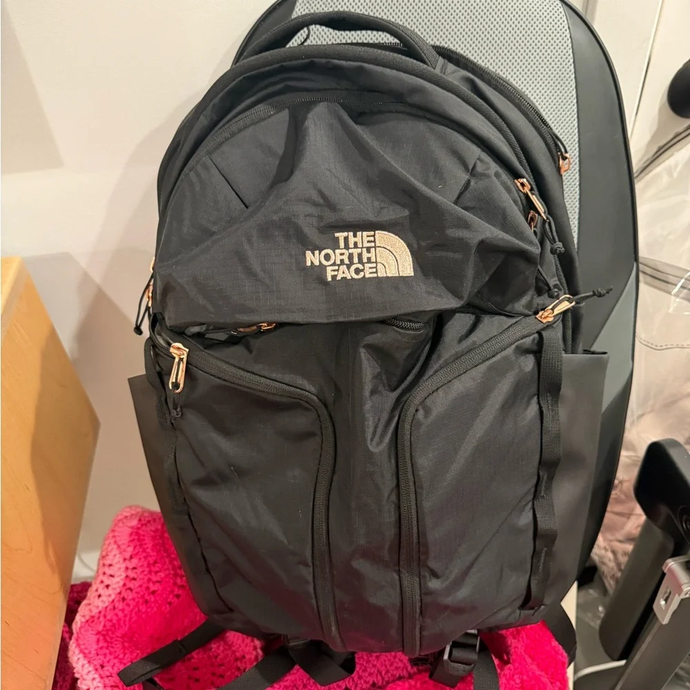 The North Face women’s Surge Luxe Black and rose gold Backpack - - Picture 1 of 12